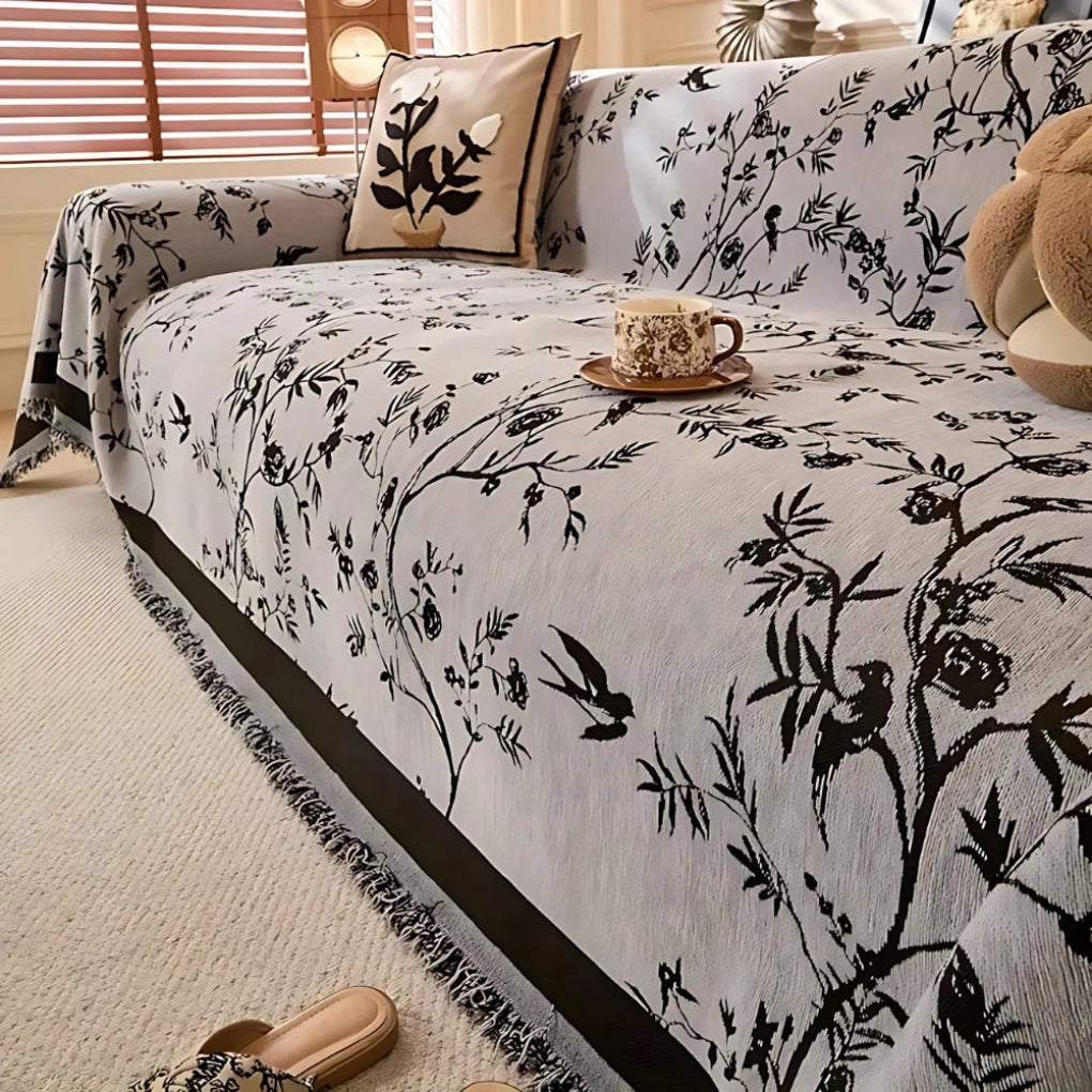 Elegant blomstermønstret kast med frynser
