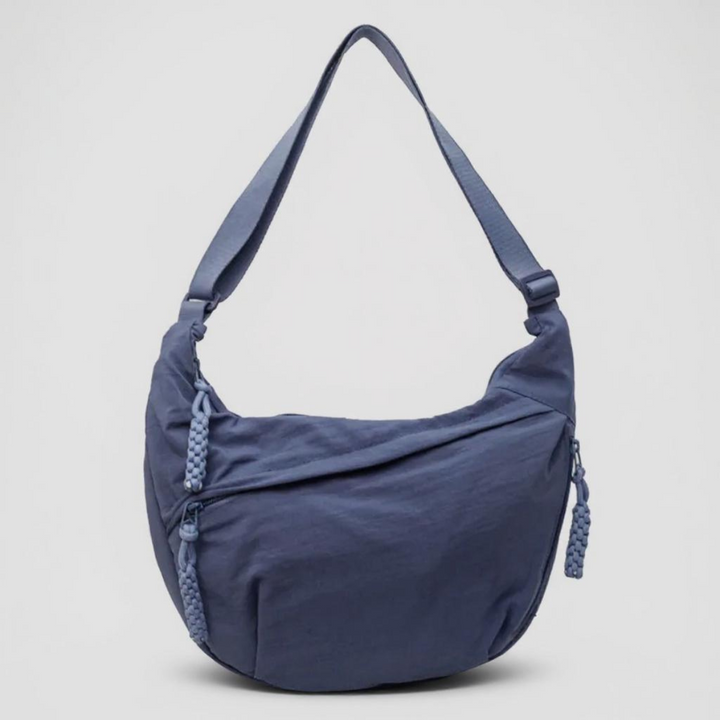 Blå nylon skulderveske med justerbar crossbody-reim
