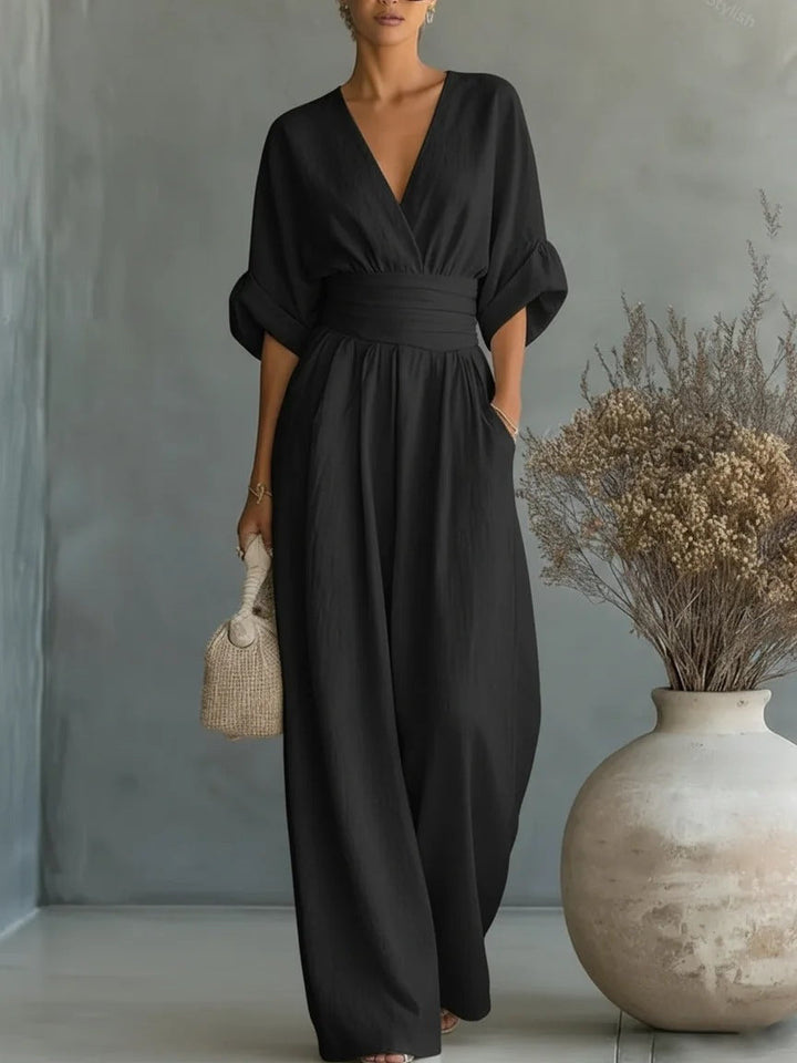 Elegant jumpsuit for damer med V-utringning og vide bukseben i høy midje