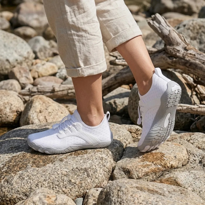 Barfotsneakers til dame med bred tåboks og fleksibel såle