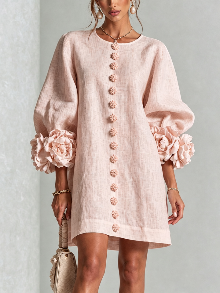 Elegant A-snittkjole med voluminøse ermer og blomsterknapper