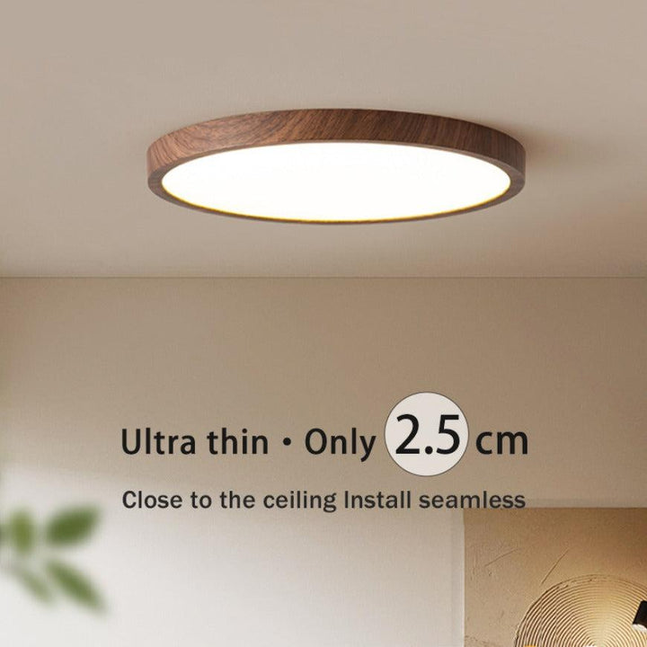 Ultratynn rund taklampe i valnøttreverk for elegante, moderne rom