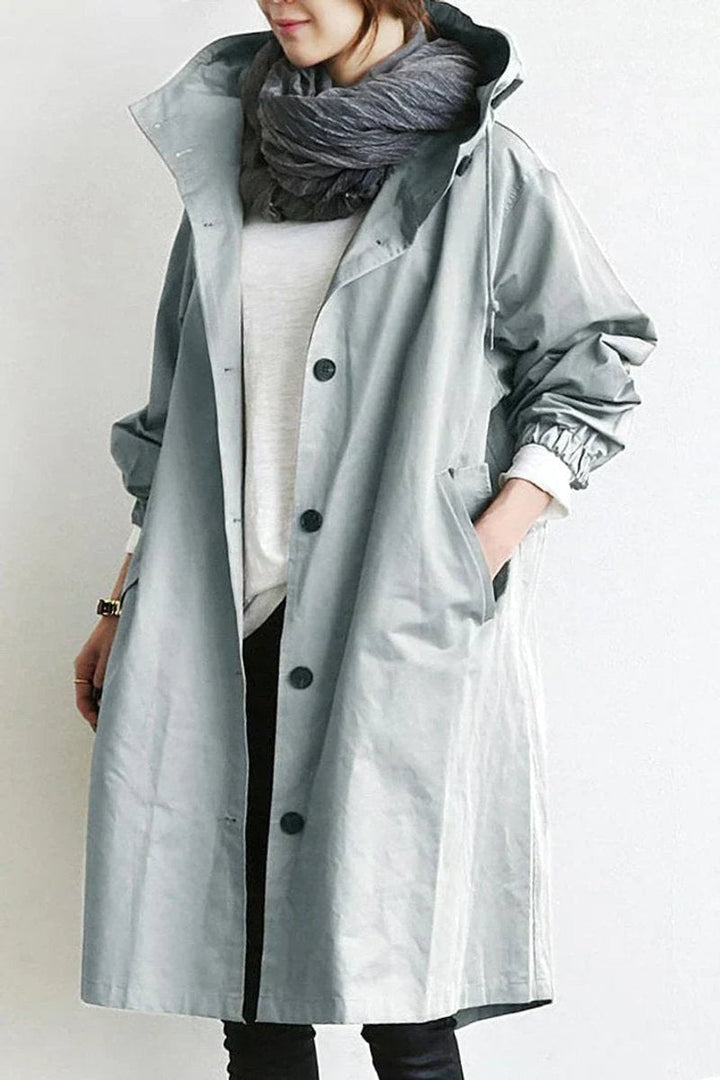 Lang trenchcoat for damer med hette, vanntett, oversized passform
