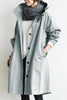 Lang trenchcoat for damer med hette, vanntett, oversized passform