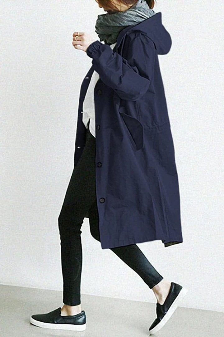 Lang trenchcoat for damer med hette, vanntett, oversized passform